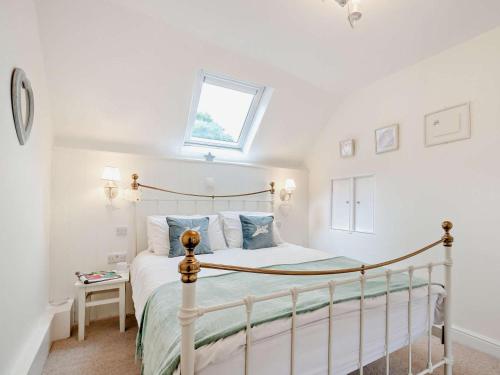 a bedroom with a bed and a window at 1 Bed in Frome oc-91715 in Woolverton