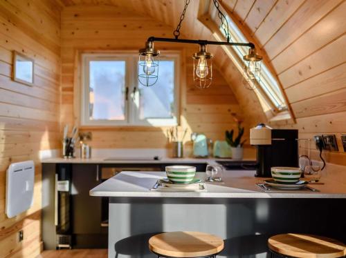 a kitchen with a island in a tiny house at 1 Bed in Alfreton oc-90518 in South Wingfield