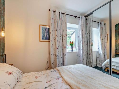 a bedroom with a bed and a window at 2 Bed in High Peak oc-94131 in Buxworth