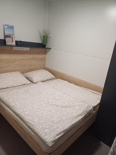 a bed in a room with a white mattress at Mobilhome Maja in Pirovac
