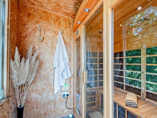 a bathroom with a shower with a glass door at 2 Bed in Ledbury oc-77377 in Yatton