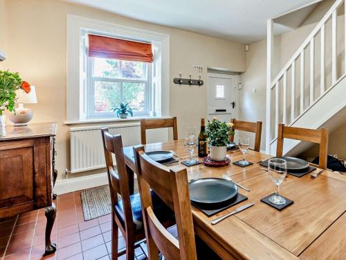 a dining room with a wooden table and chairs at 3 Bed in Baslow oc-pk908 in Baslow