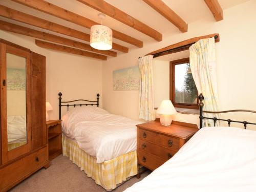 a bedroom with two beds and a window at 2 Bed in Hope Valley oc-pk431 in Aston