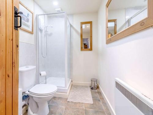a bathroom with a toilet and a glass shower at 1 Bed in Leighton oc-80726 in Leighton