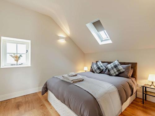 a bedroom with a bed and a window at 1 Bed in Bakewell oc-91367 in Youlgreave