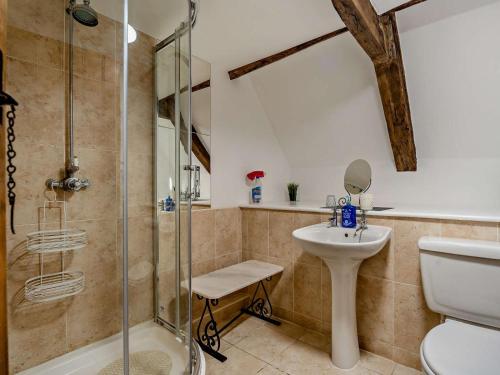 a bathroom with a shower and a toilet and a sink at 8 Bed in Bristol oc-87469 in Winterbourne