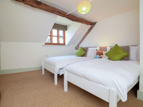 two beds in a attic bedroom with a window at 2 Bed in Ludlow oc-40329 in Ludlow