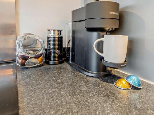 a coffee maker sitting on top of a kitchen counter at 2 Bed in Warwick oc-93085 in Warwick