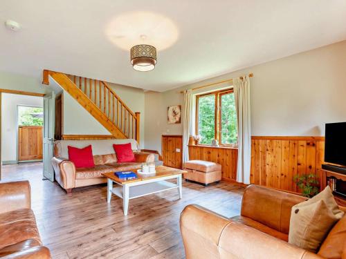 a living room with a couch and a table at 3 Bed in Ledbury oc-77379 in Yatton