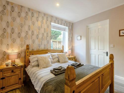 a bedroom with a large bed and a window at 1 Bed in Buxton oc-74351 in Flash