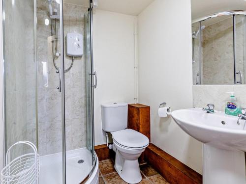 a bathroom with a toilet and a sink and a shower at 1 Bed in Shrewsbury oc-80587 in Leighton