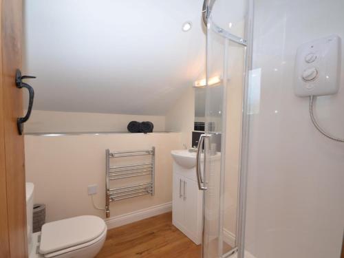 a bathroom with a toilet and a glass shower at 2 Bed in Bristol oc-75697 in Bristol