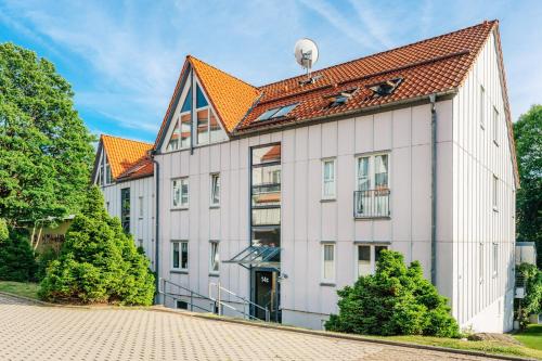 a large white building with an orange roof at Klippenblick in Schierke
