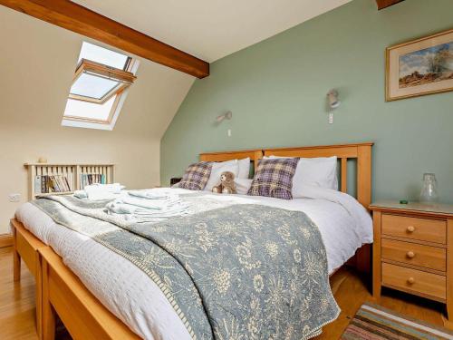 a bedroom with a bed with a teddy bear on it at 3 Bed in Ludlow oc-chl38 in Ashford Carbonell