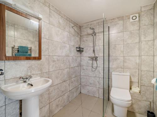 a bathroom with a toilet and a sink and a shower at 1 Bed in Bristol oc-72835 in Chew Magna