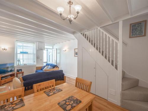 a living room with a couch and a table at 2 Bed in Aberdyfi oc-dy047 in Aberdyfi