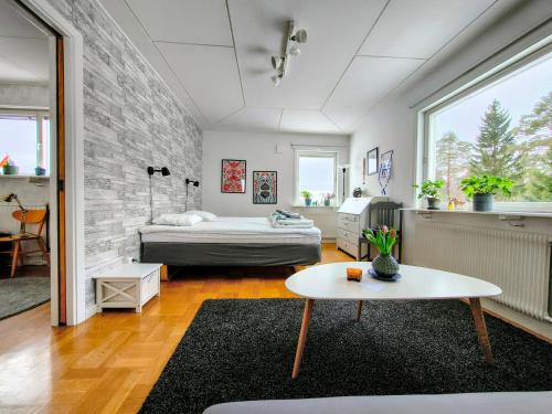 a room with a bed and a table in it at Gästrum Vasaloppets vintervecka in Mora