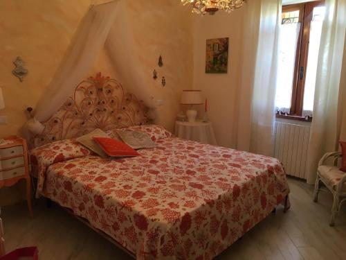 a bedroom with a bed with two books on it at Apartment in a villa with a private pool in Cannigione