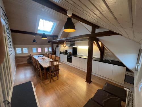 a kitchen and dining room with a table and chairs at Apartment 180 qm BIBERBURG, in der romantischen Rödermühle an der Fränkischen Saale in Deutschlands Mitte, 8 km zur A7 in Hammelburg