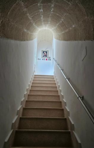 a staircase leading up to a tunnel at Da Me & Te in Ginosa
