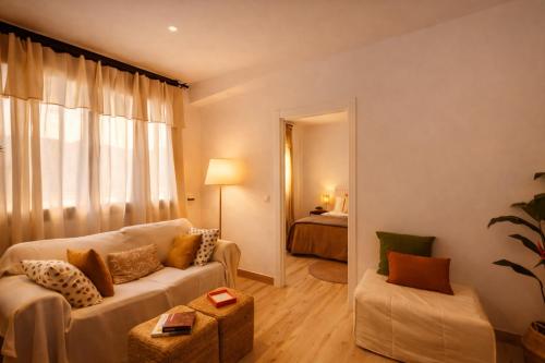 a living room with a couch and a chair at Apartament a Sant Celoni, Montseny, Barcelona in Sant Celoni