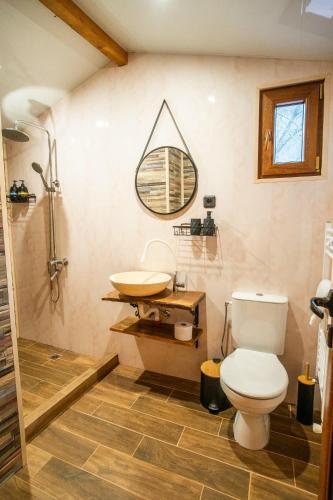 a bathroom with a toilet and a sink at Green View 2 in Skrino