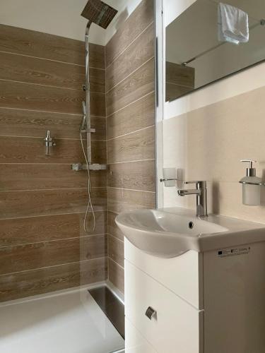 a bathroom with a sink and a shower at l'impronta in Gorizia
