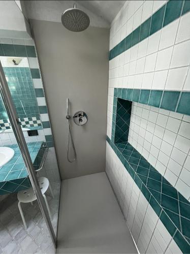 a bathroom with a shower and a sink at Casa di Giò - Comfy Lake Como Attic in Malgrate