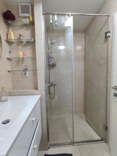 a shower with a glass door in a bathroom at Goce 20 New Belgrade,near hotel Jugoslavija in Tošin Bunar