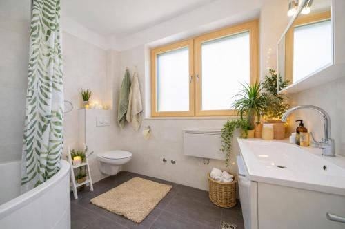 a bathroom with a tub and a sink and a toilet at Villa Slano in Slano