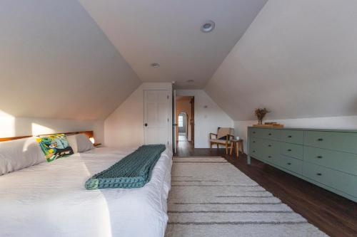 a bedroom with a large bed and a dresser at Private Fire Pit Pool Table Barry Manor in Barryville