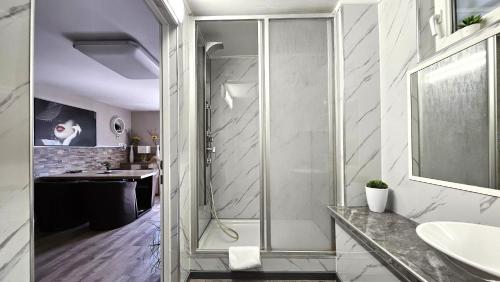 a bathroom with a shower and a sink at Flatprovider - Manuela Apartment Vienna in Vienna