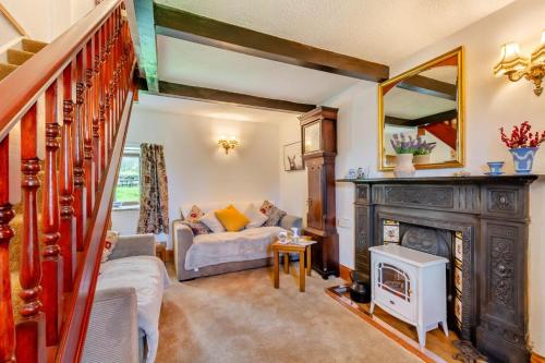 a living room with a fireplace and a couch at 2 Bed in Clitheroe oc-la156 in Harrop Fold