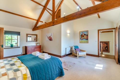 a bedroom with a large bed and a fireplace at 2 Bed in Thwing oc-t29012 in Thwing