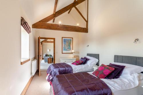 two beds sitting in a room with a window at 4 Bed in Thwing oc-t29013 in Thwing