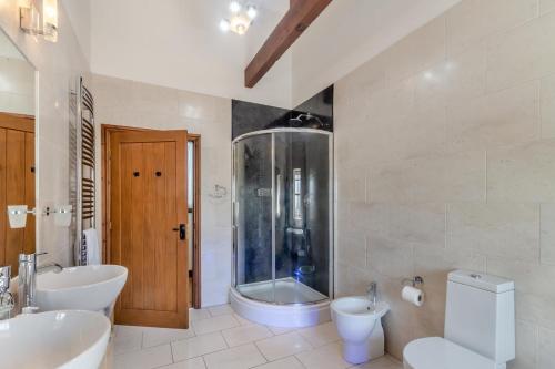 a bathroom with two sinks and a shower and a toilet at 3 Bed in Thwing oc-t29011 in Thwing