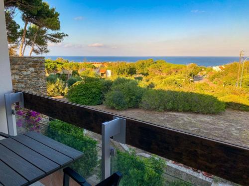 a view of the ocean from the balcony of a house at Stintino Apartments in Stintino
