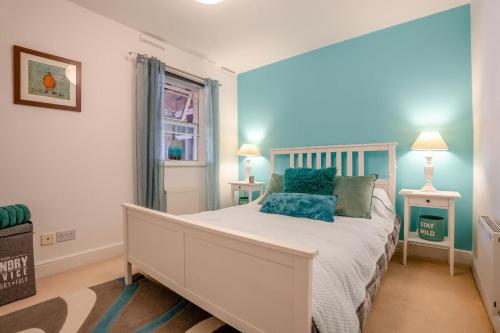 a bedroom with a white bed and two lamps at 2 Bed in Whitby oc-h31801 in Whitby