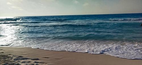 a view of the ocean from the beach at الساحل الشمالى قرية جوليانا أمام قرية قناة السويس North Coast Juliana Resort Vip Chalet in Dawwār Muşādif Yūnus