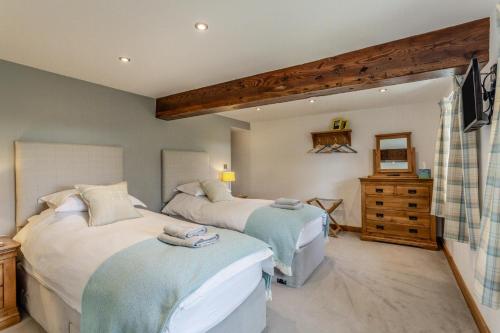 a bedroom with two beds and a dresser at 2 Bed in Pickering oc-t29975 in Middleton