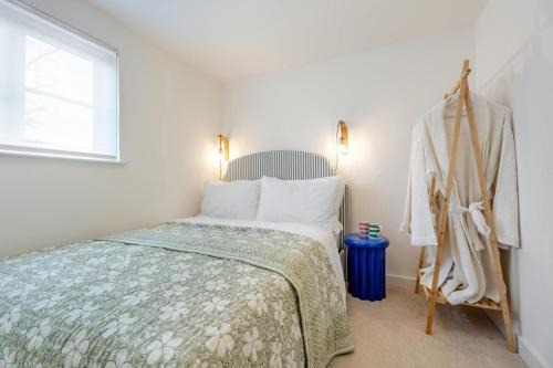 a white bedroom with a bed and a window at 2 Bed in Helmsley oc-p36613 in Helmsley