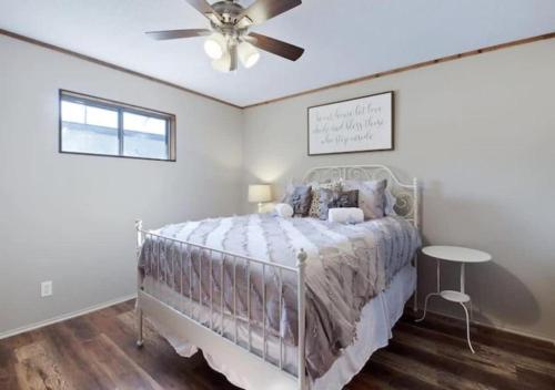 a bedroom with a bed and a ceiling fan at Pawnee Duplex in Chattanooga Unit 1 in Chattanooga