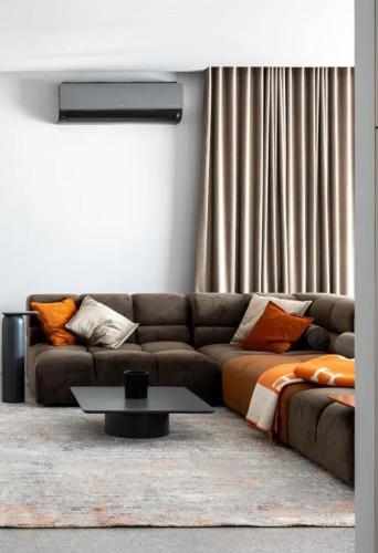 a living room with a couch and a table at Superb 2 Bed Apartment in George Town