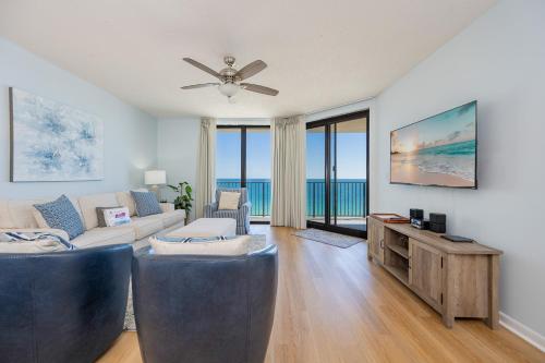 a living room with a couch and a tv at Phoenix X 1110 in Orange Beach