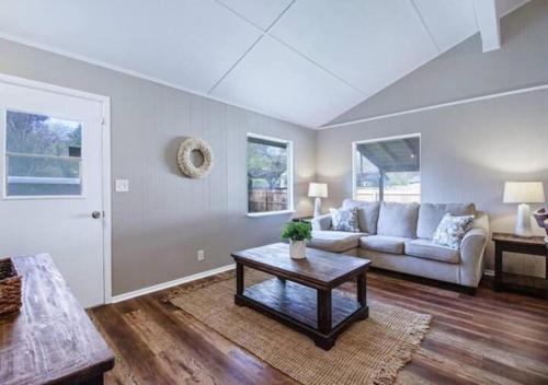 a living room with a couch and a table at Pawnee 2 - Newly Renovated Duplex in Chattanooga