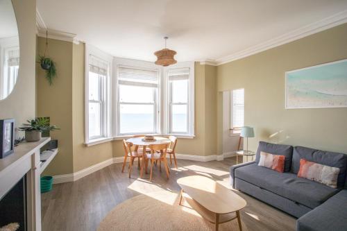 a living room with a couch and a table at Seaview in Worthing