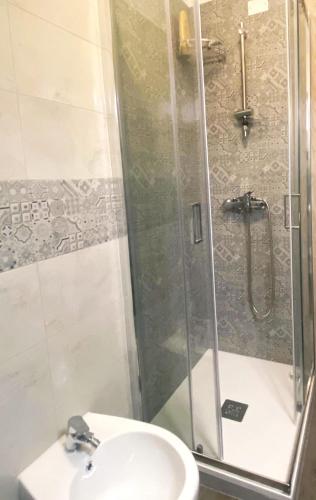 a bathroom with a shower and a toilet and a sink at S1 Home Sila in Camigliatello Silano