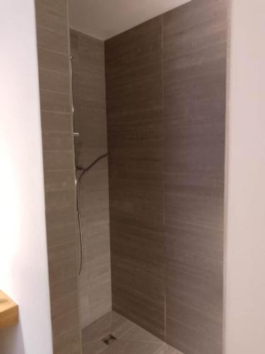 a shower with a glass door in a bathroom at Casa Edo in Ponte Tresa