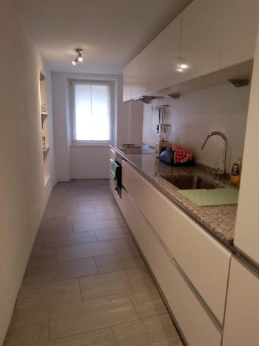 a kitchen with a sink and a counter top at Casa Edo in Ponte Tresa