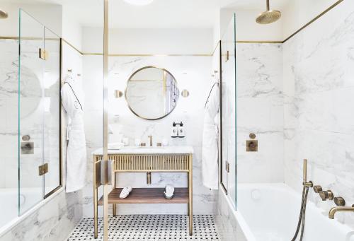a bathroom with a sink and a shower at Grand Powers Hotel in Paris